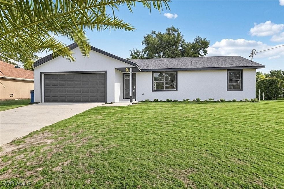 Single story home featuring stucco siding, a garag