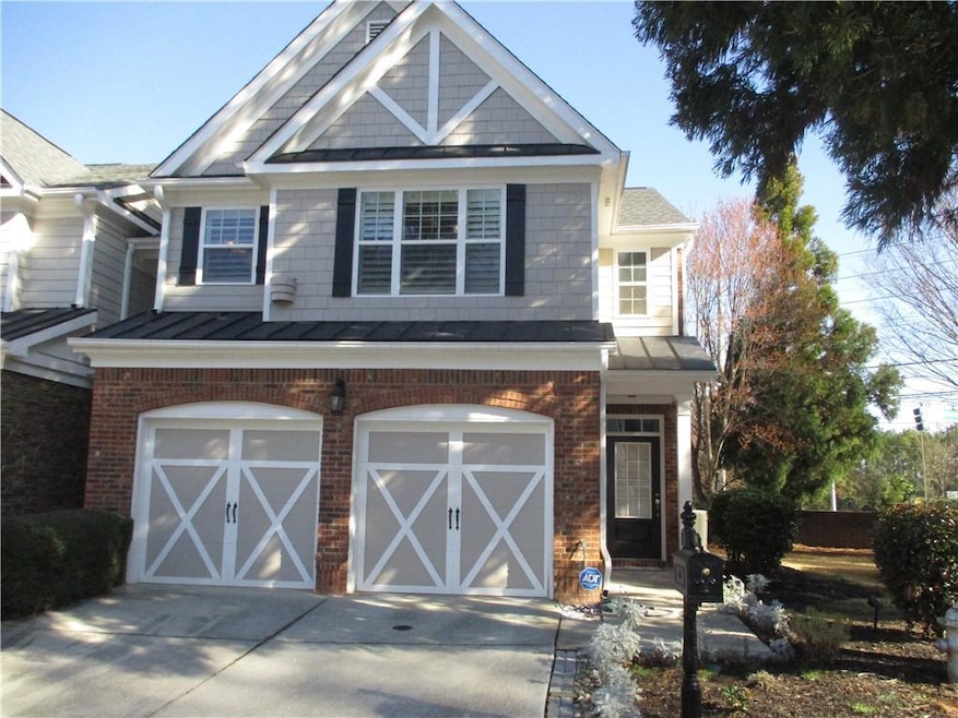 View of front of home with a standing seam roof, m