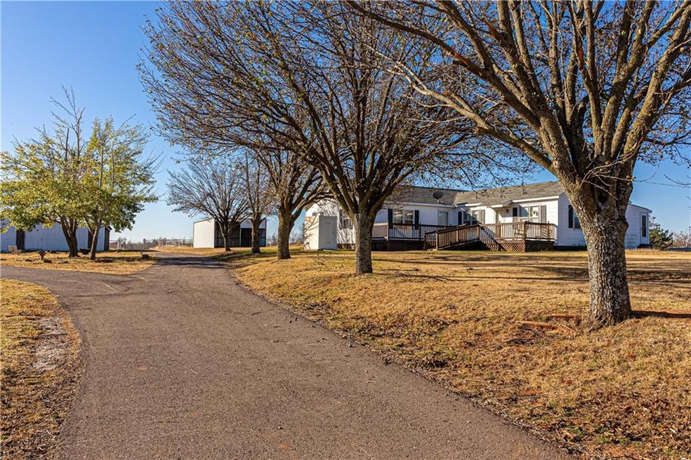 Entry, circle drive, and main house.