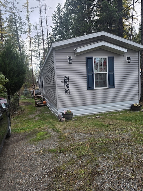 View of home's exterior with a yard