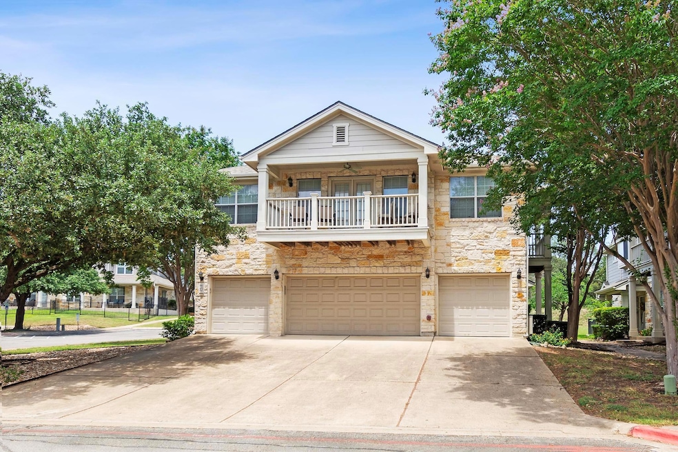 Multi unit property with stone siding, a garage, 