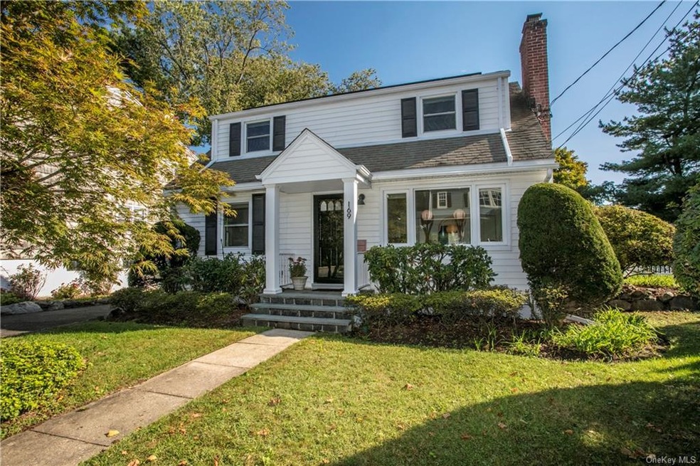 Curb appeal and charm sitting on a quiet tree-line