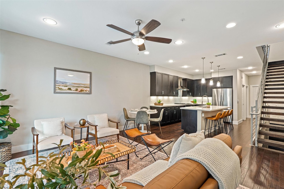 Living room featuring recessed lighting, dark woo