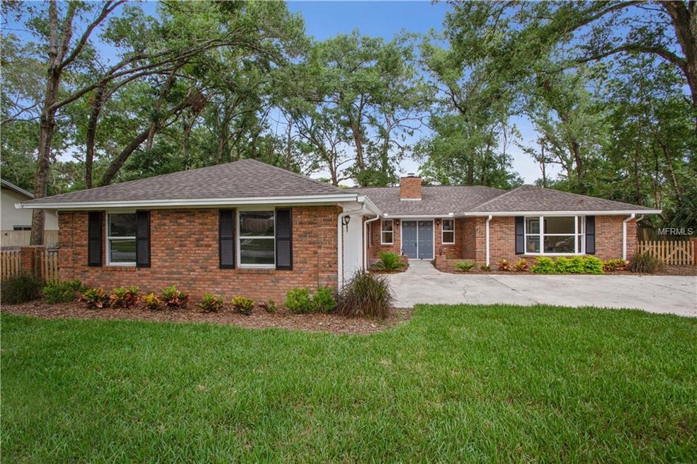 The classic brick exterior and beautiful landscapi