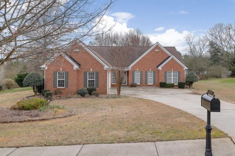 Brick and cement siding on a level lot