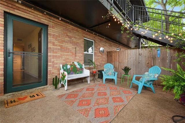Rare, patio unit with tree covered canopy of flowe