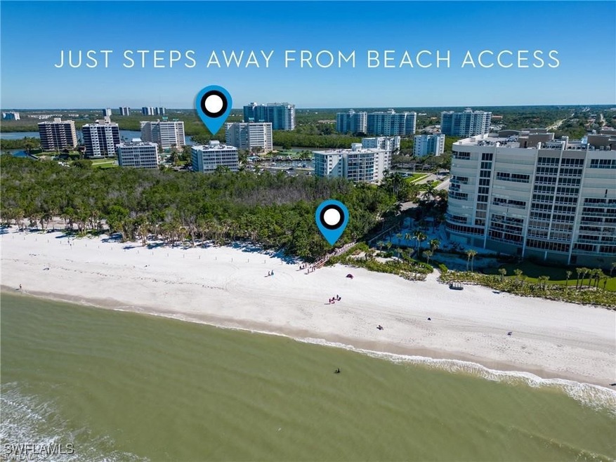 Bird's eye view featuring a water view and a beach