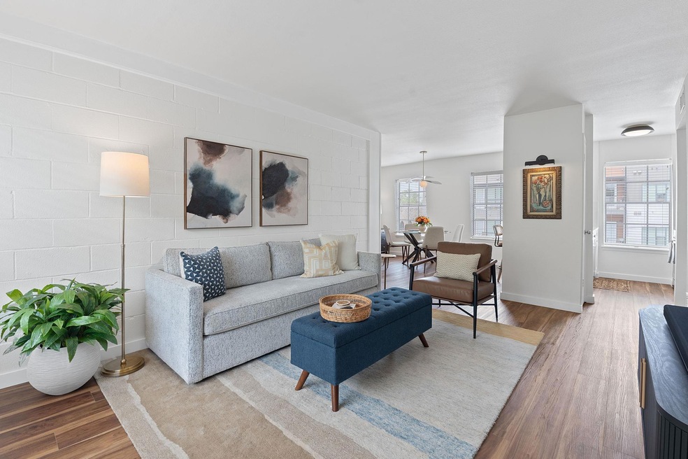 Living room with baseboards and wood finished flo