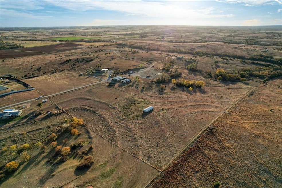 Aerial overview of property's location with rural landscape. 10539 N 2000 Rd, Elk City, OK 73644.