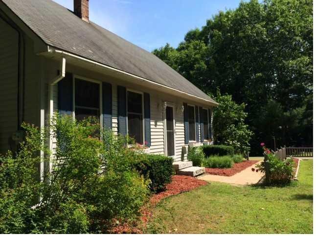 Exterior Front. Set back from the...