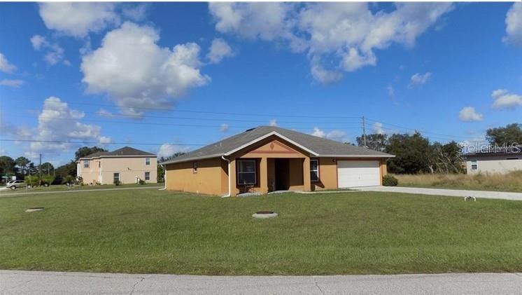 EXTERIOR FRONT OF HOME WITH CORNER LOT