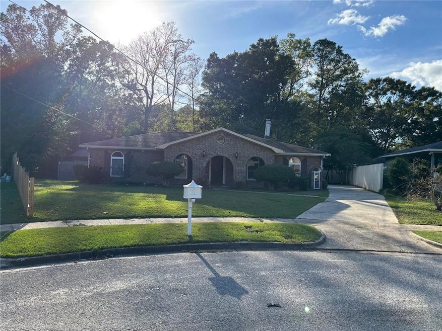Single story home featuring a front yard