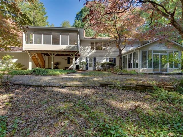 Rear view of home -w  large wooded back yard