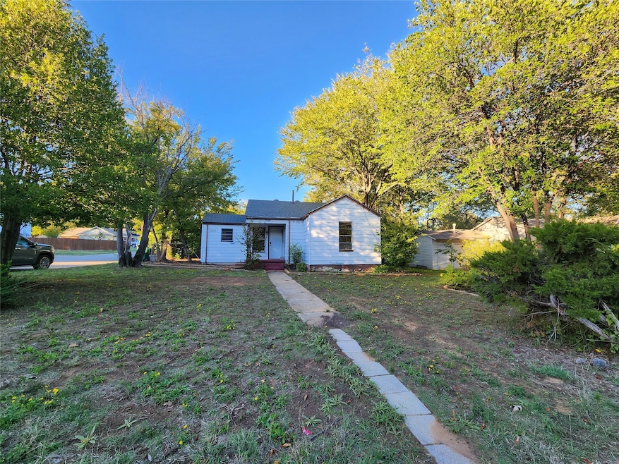 View of front of property with a front yard