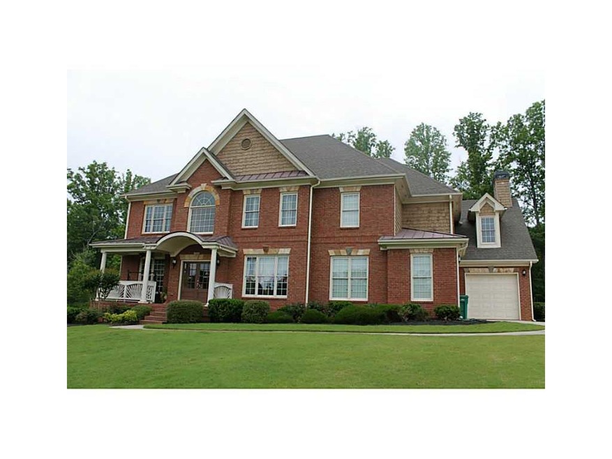 Exterior Front. Brick beauty with 3 car garage on 