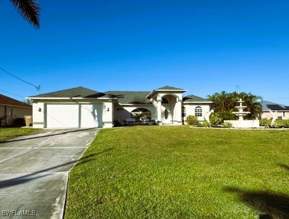 Single story home featuring a garage and a front l