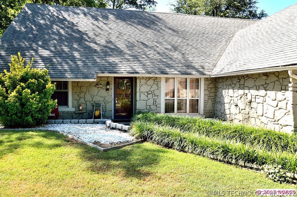 Close up of front of home.  Nice flower beds.  Rea