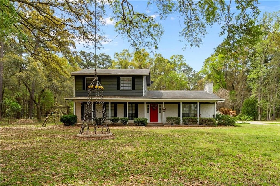Traditional-style home featuring covered porch and