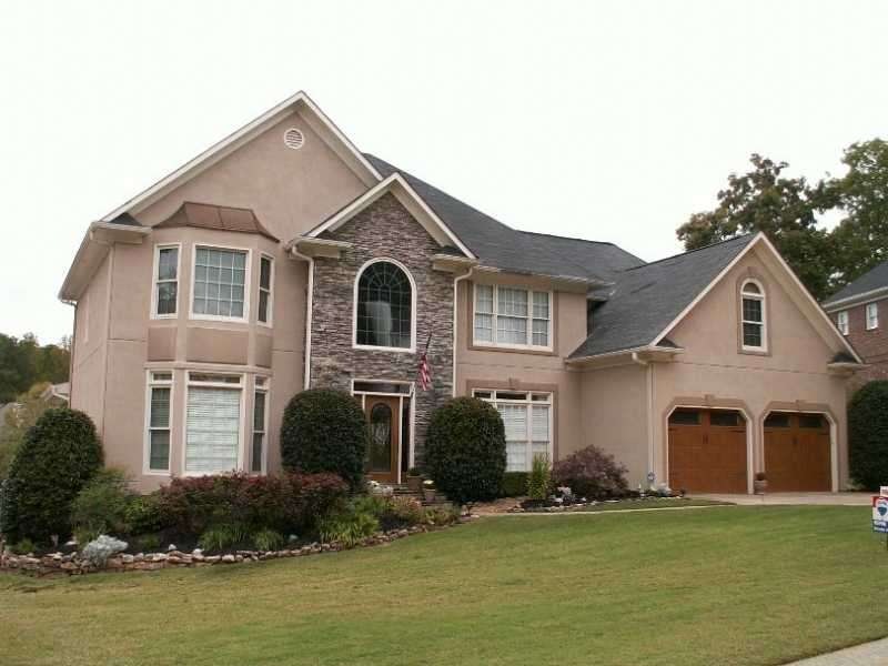 Exterior Front. Elegant front elevation!  Lake lot