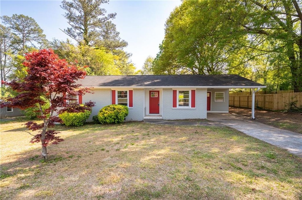 Ranch-style house with a front yard