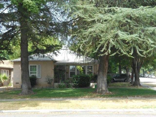 Front View with beautiful shade trees on a corner 