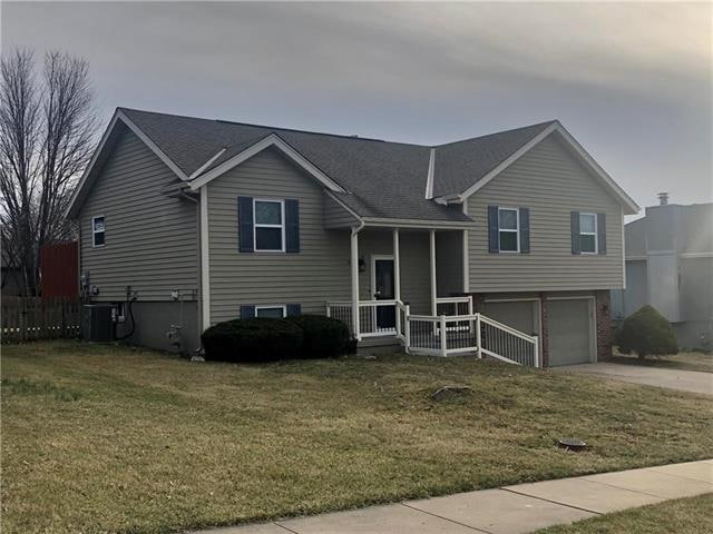 411 Blue Grass Dr, Raymore, MO 64083 - photo 1