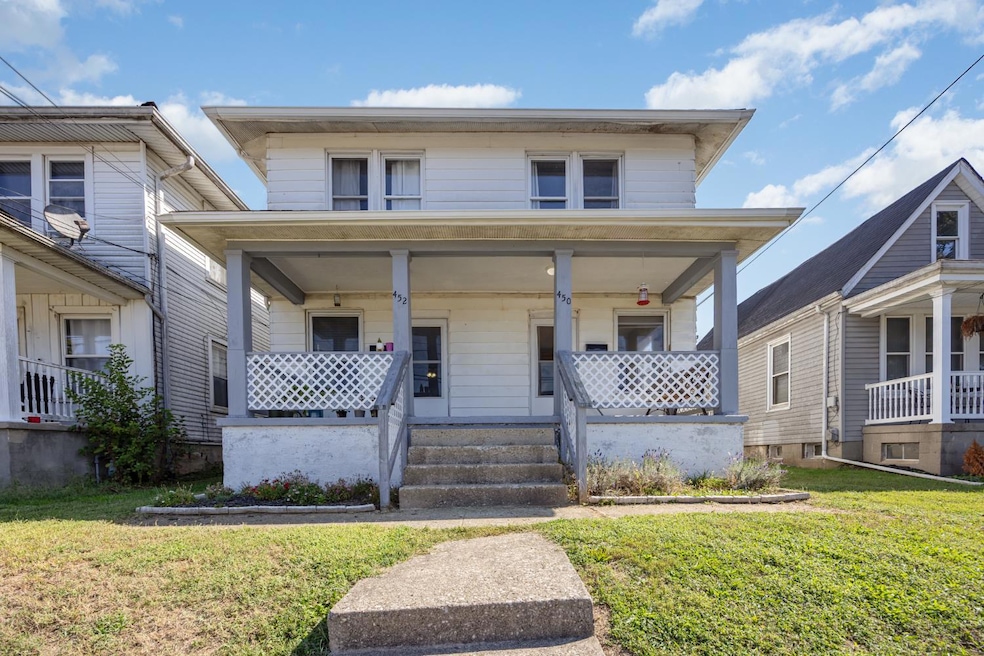 True 2-family home 452 on the left, 450 on the right. Each has its own front and rear entrances.
