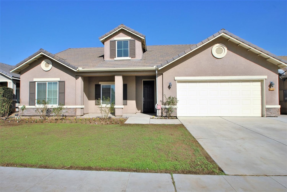 Front View, newly seeded lawn area, tile roof, stu