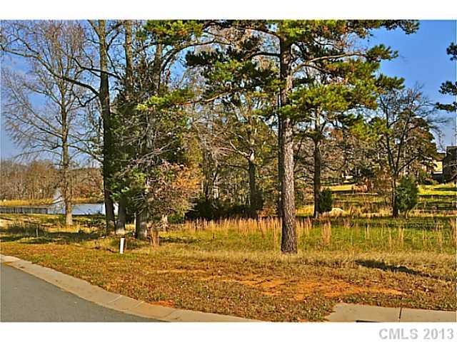 Exterior Front - Beautiful Corner Lot on the Pond