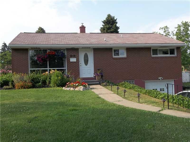 Exterior Front. Three bedroom brick ranch with pav