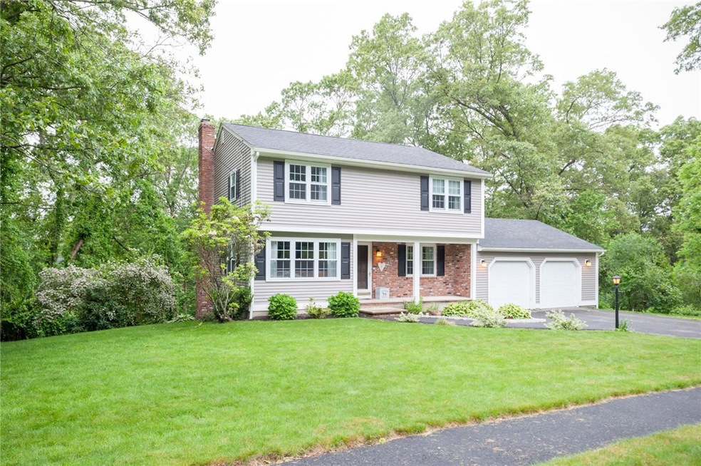 A STATELY COLONIAL WITH RECENT VINYL SIDING, ARCHI