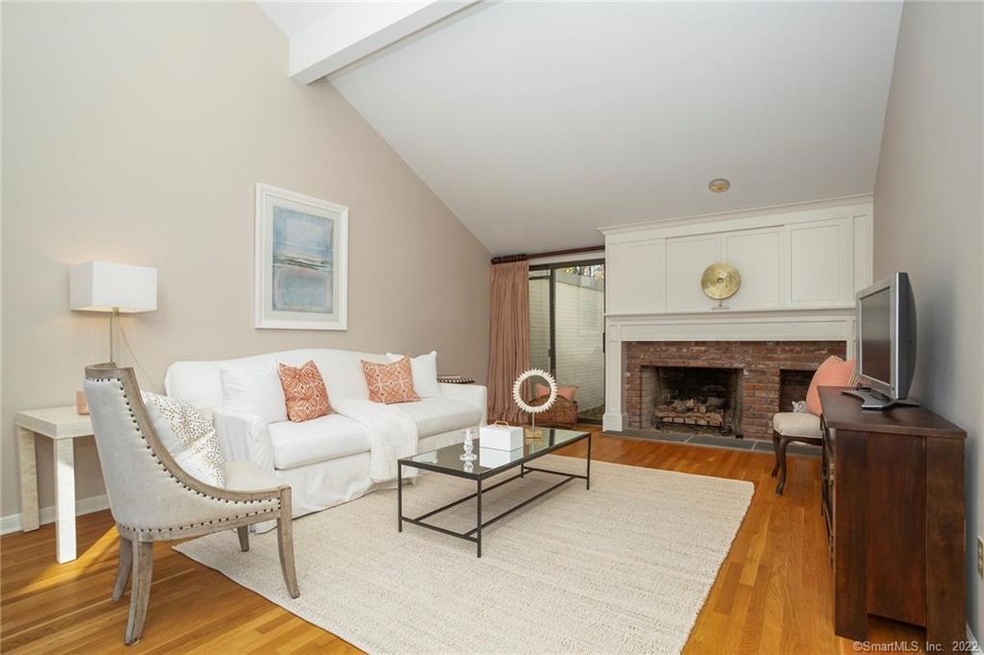 Open and inviting living room with gas fireplace a