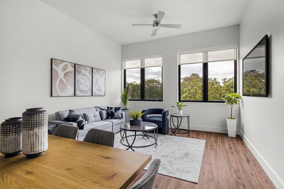 Living room with baseboards, wood finished floors