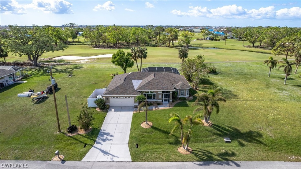 View looking west towards first fairway of Coral Oaks Golf Club behind this home.
