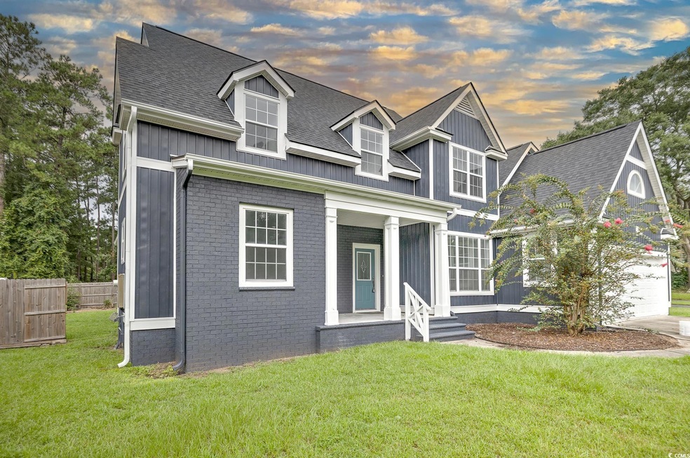 View of front of property featuring a lawn