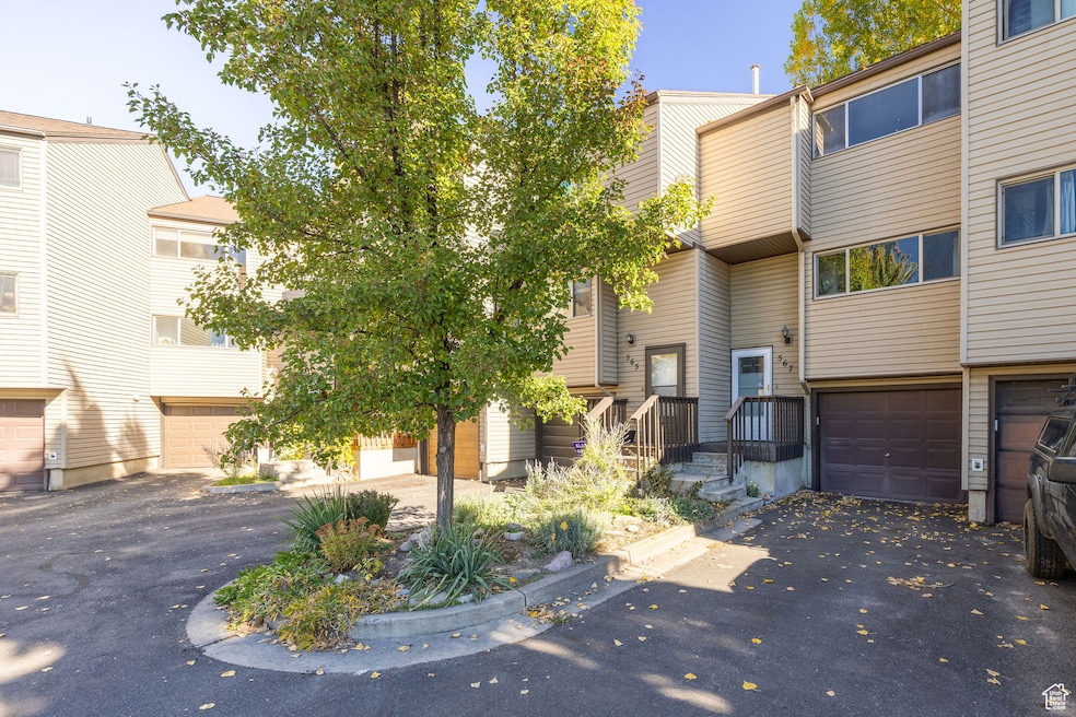 View of front of property featuring driveway and a garage