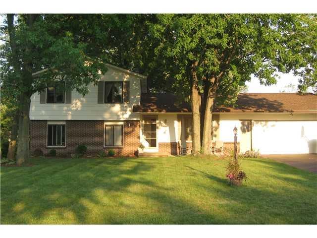Exterior Front Beautiful Home with mature trees an