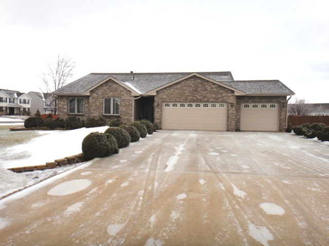 Beautiful Curb Appeal with Brick Front and 3 Car G
