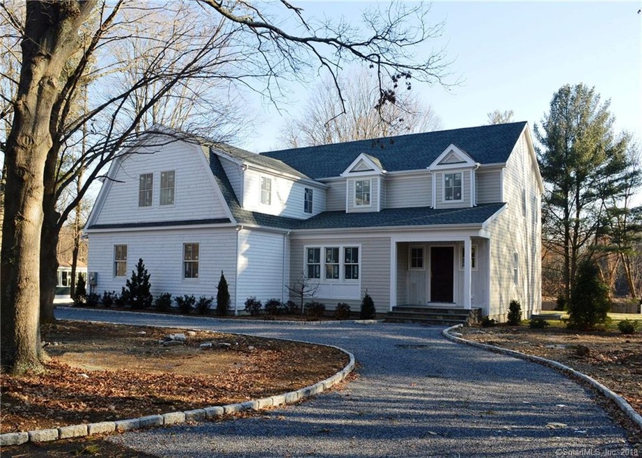 Gorgeous curb appeal with large half circle drivew