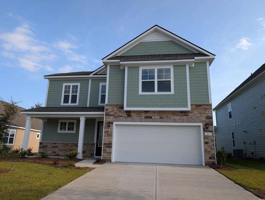 View of front of property with a garage, central a