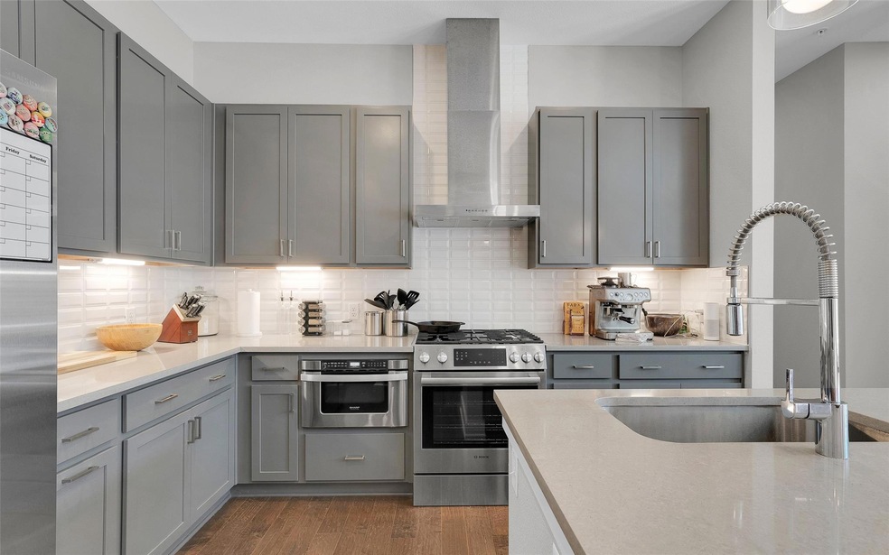 Kitchen featuring a sink, tasteful backsplash, wa
