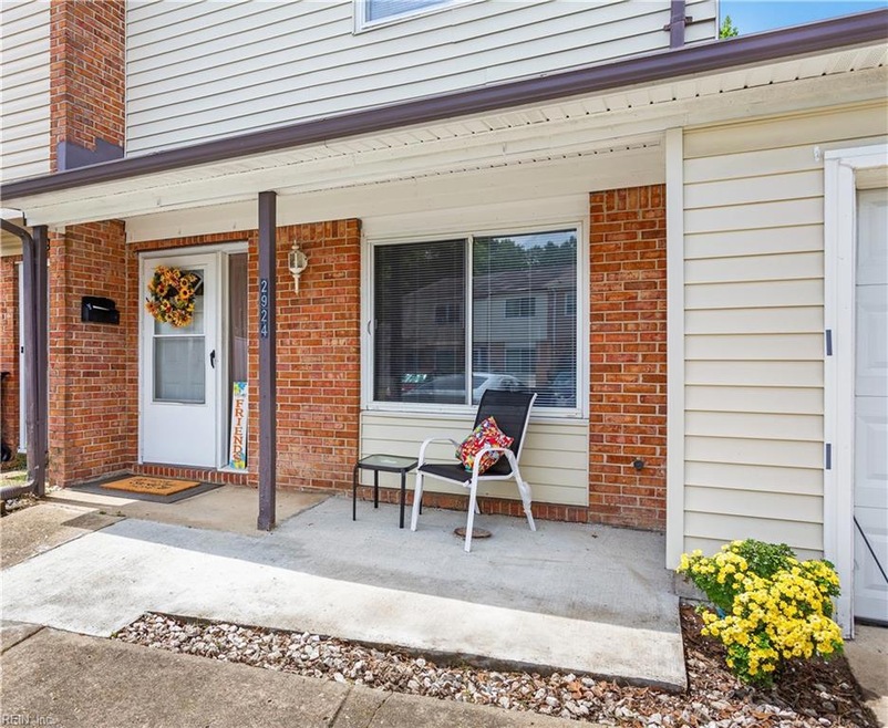 Front Porch.  3 parking spaces and one car garage