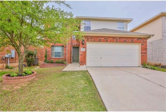 Nice curb appeal with brick border around flower b
