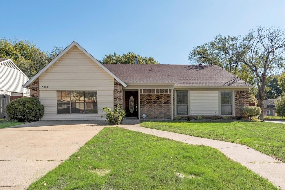 Single story home with a front lawn