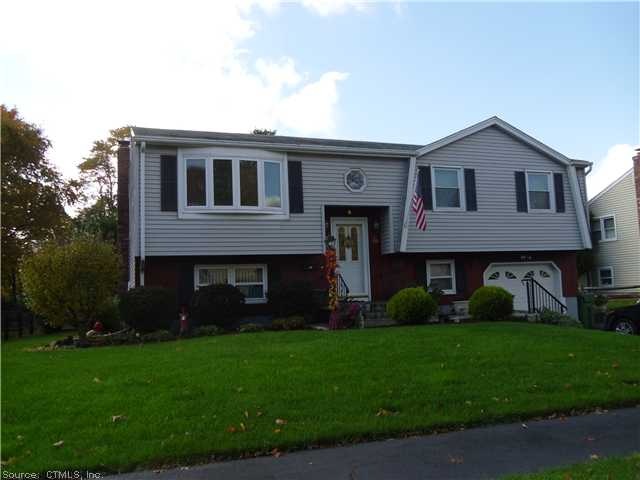 Exterior Front. Vinyl sided, newer windows,lusciou