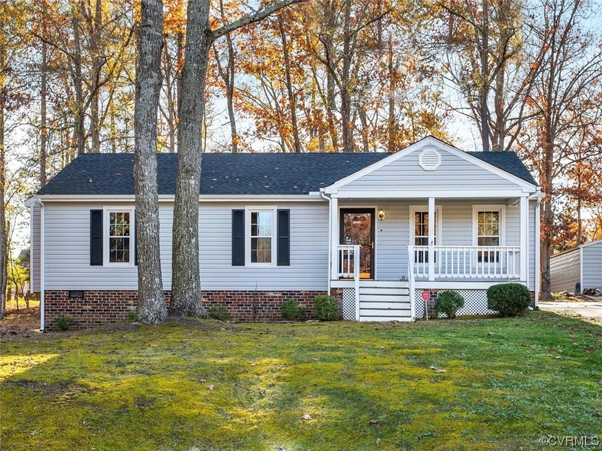 View of front of home featuring a front lawn and c