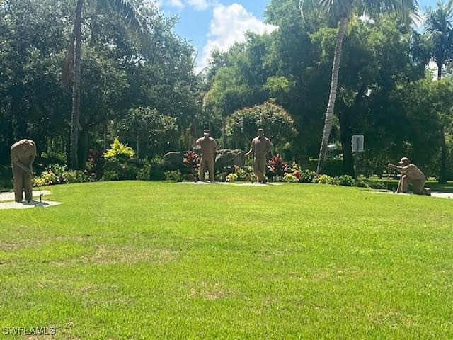 View of property's community featuring a lawn