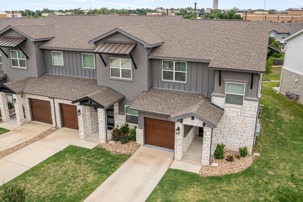 Craftsman-style home featuring board and batten siding, a shingled roof, and a front yard