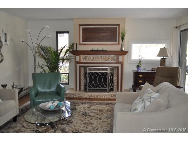 Living room with custom fireplace mantle