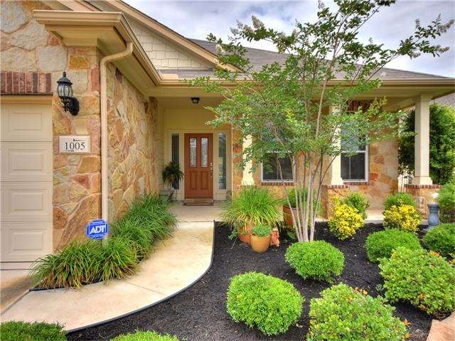 Gorgeous landscaped entry has been designed for ea
